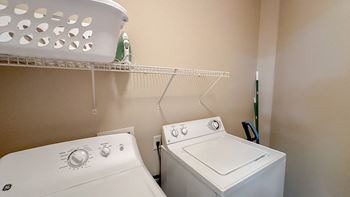full size washer and dryer in the laundry room of a home